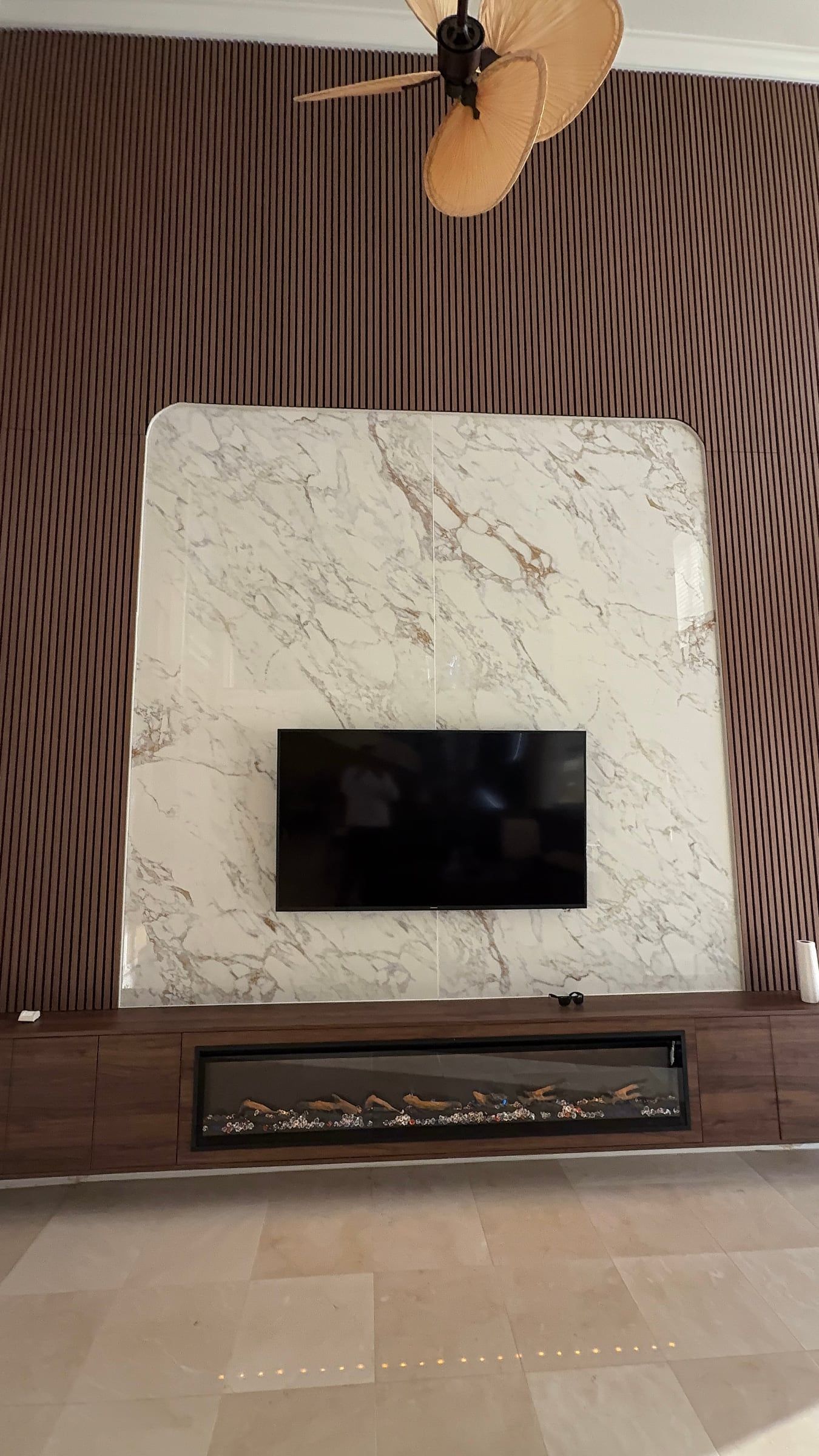 Double-Height Porcelain Slab Media Wall in Sarasota, FL