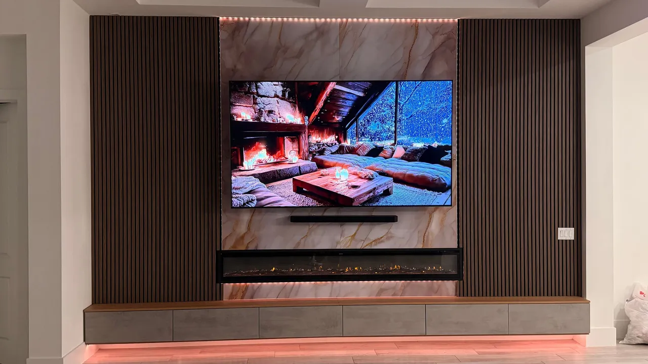 Wood slat media wall with a linear electric fireplace in Orlando, FL